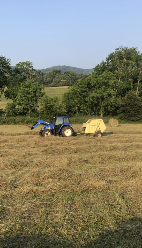 Tractor baling hay